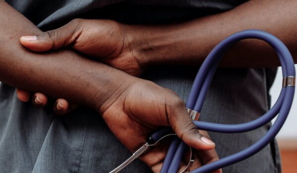 doctor's hands with stethoscope.