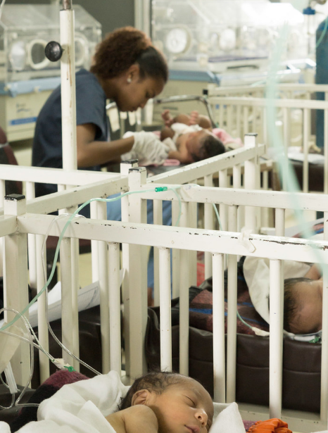 a nurse taking care of a newborn