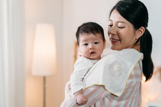 Girl holding a baby in her arms